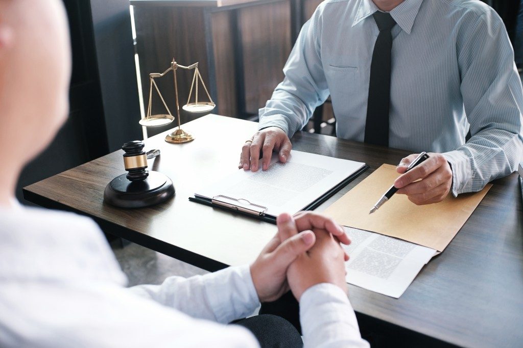 man consulting with a lawyer