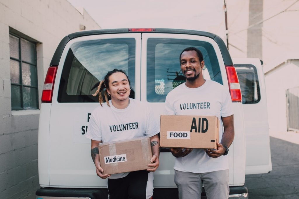 volunteers holding boxes