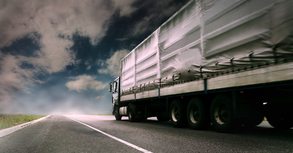 a truck speeding through an empty highway