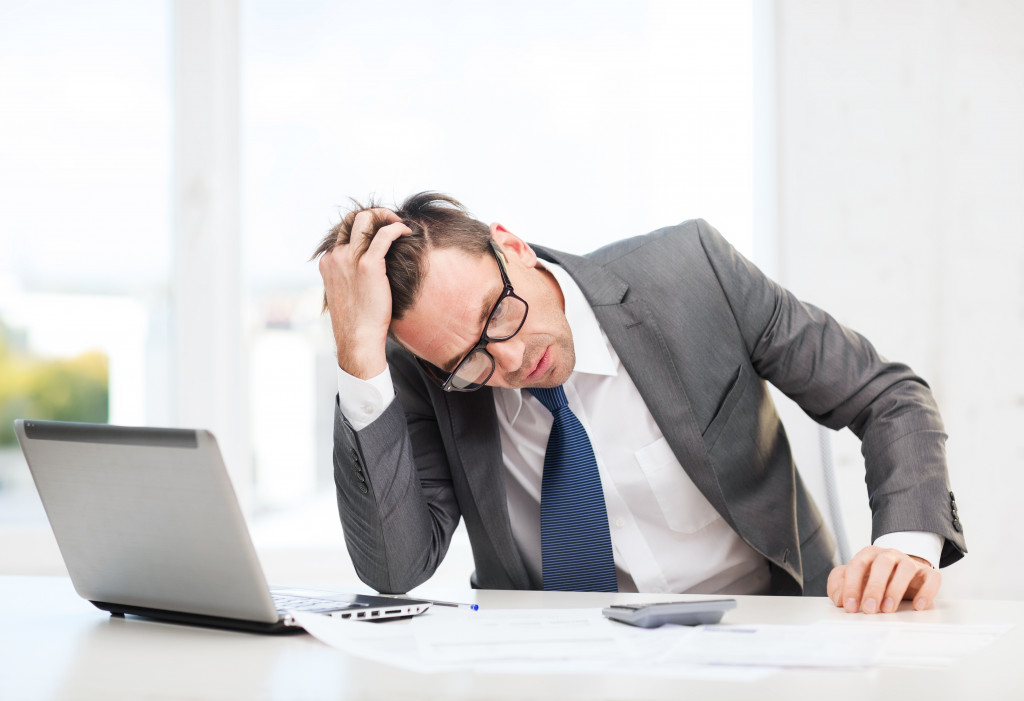 male entrepreneur feeling stressed at work