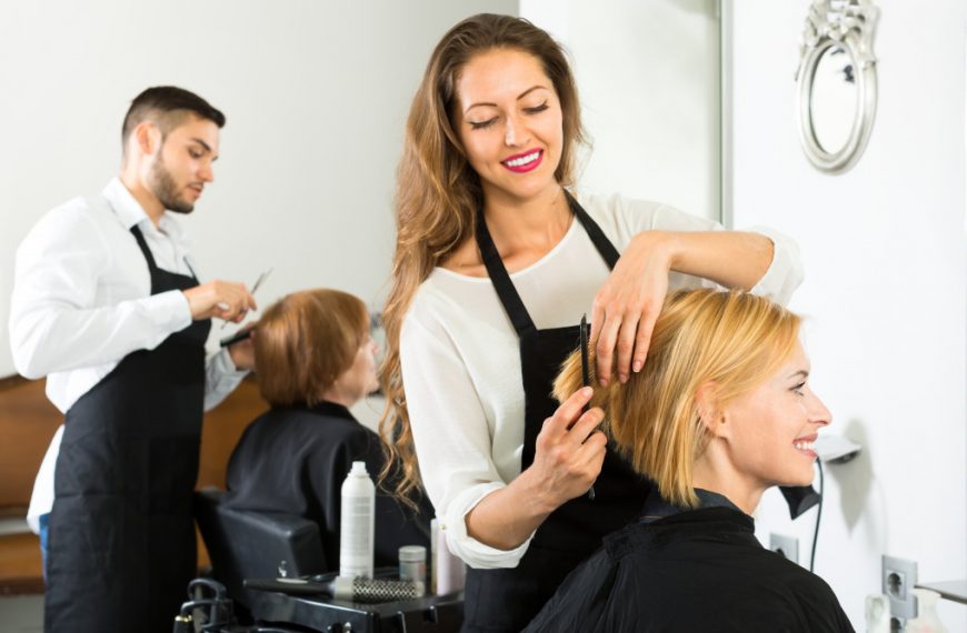 woman treating a client's hair